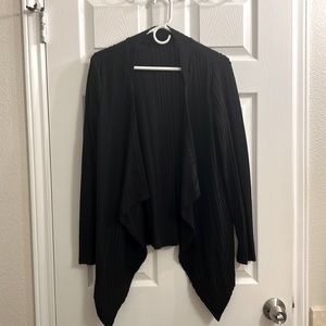 Thin black cardigan. No button/zip- no pockets